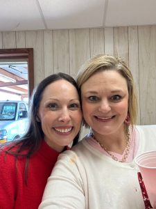 Casey standing next to a woman