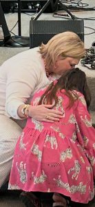 Casey praying with a child